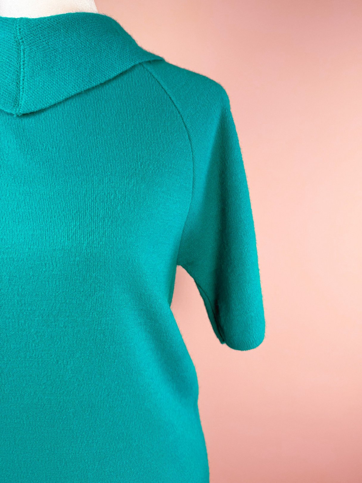 Teal green knit top with a collar and short sleeves from a 1960s women's skirt set.