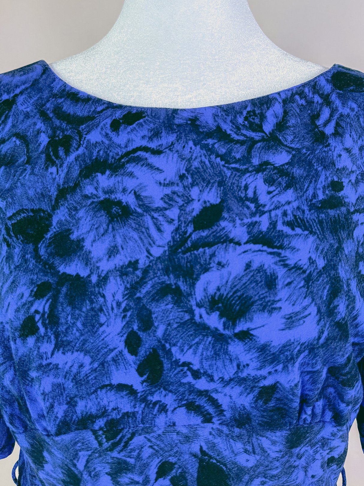 Midnight blue dress featuring a floral pattern, designed for women in the 1960s style.