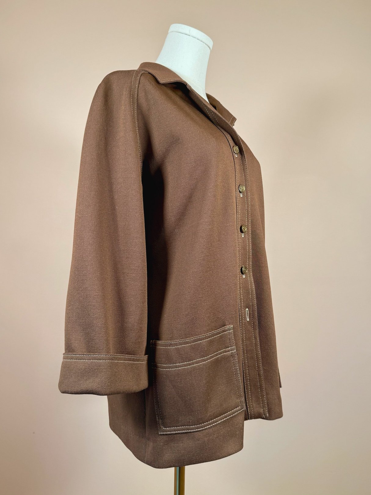 1960s brown chestnut women's jacket with a button front and side pockets.