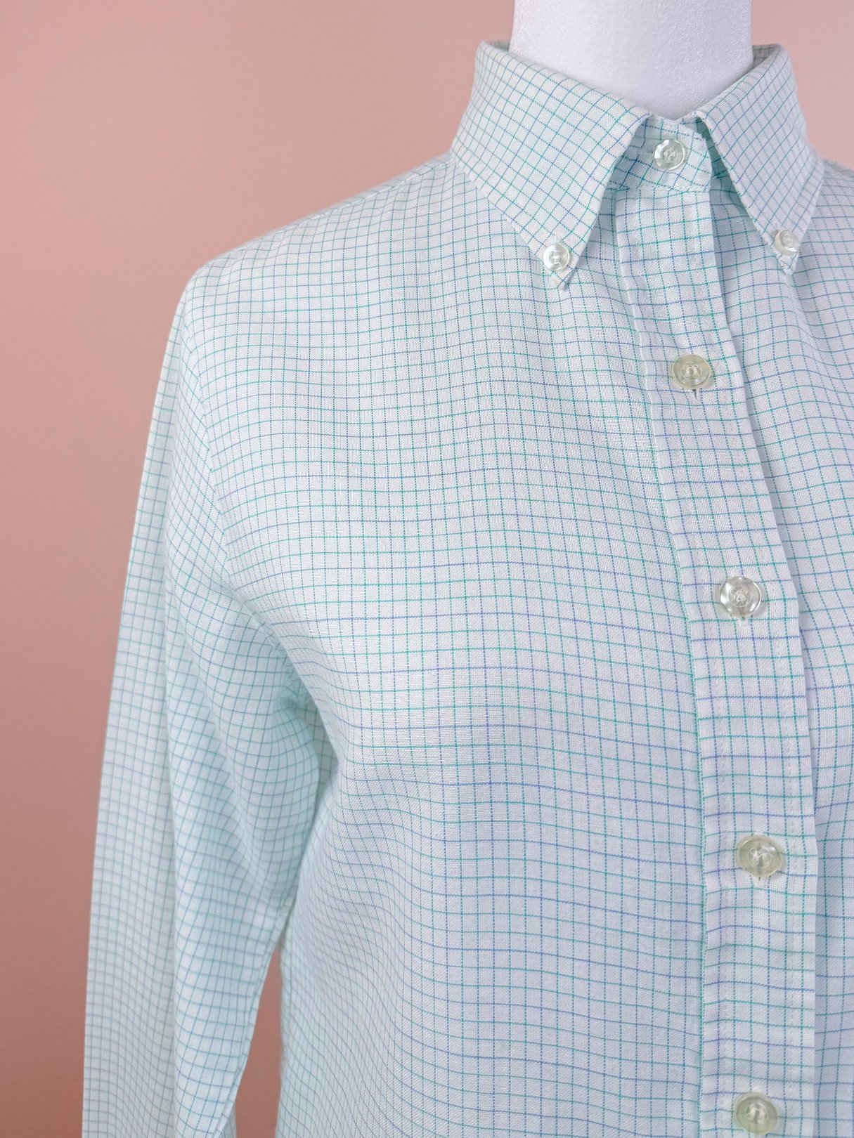 White checkered button down shirt for women featuring a classic collar and long sleeves, reflecting a 1980s style.