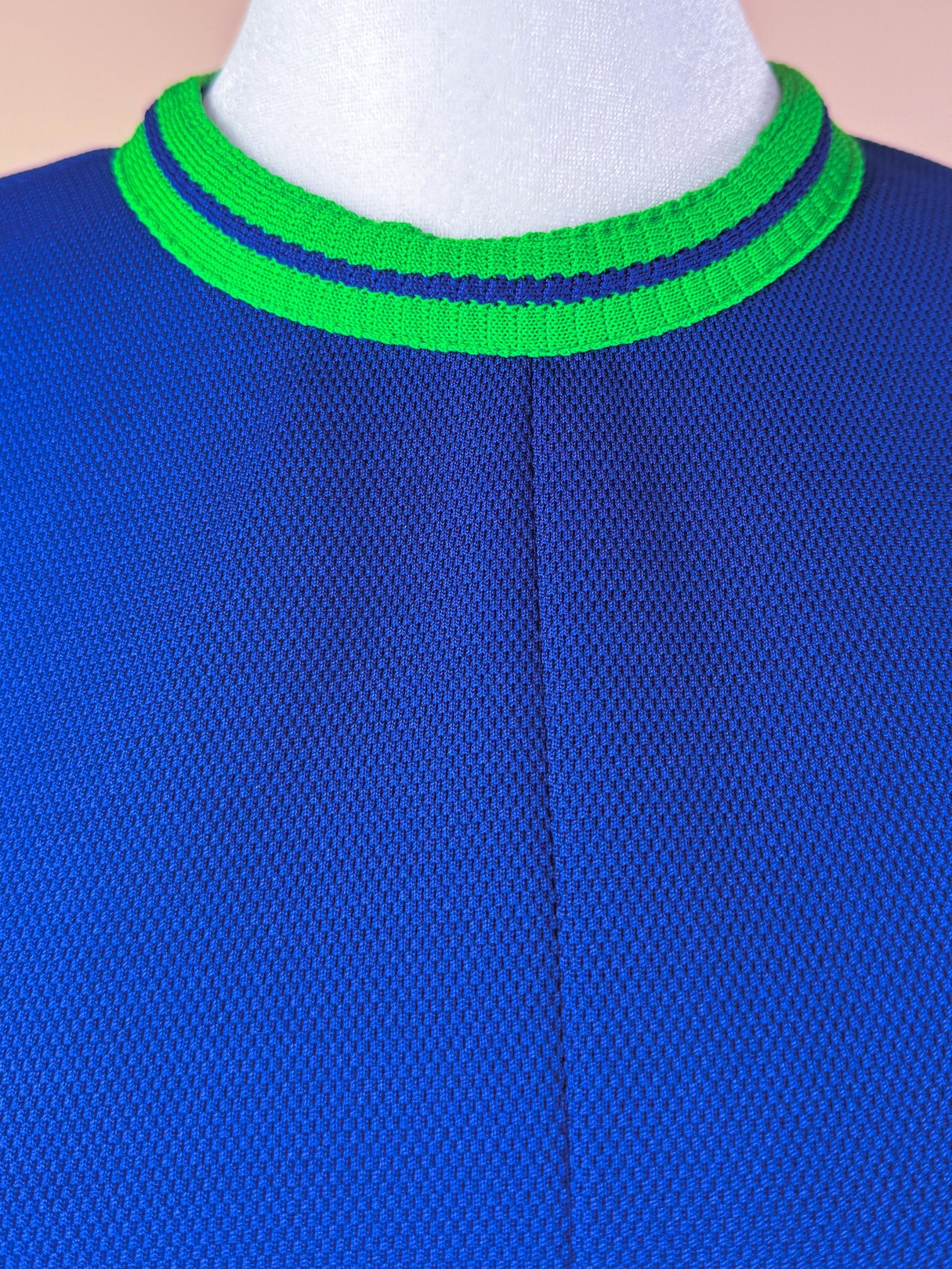 Pacific Lines Dress featuring a blue textured fabric with a green and blue striped collar, designed for women in a 1970s style.