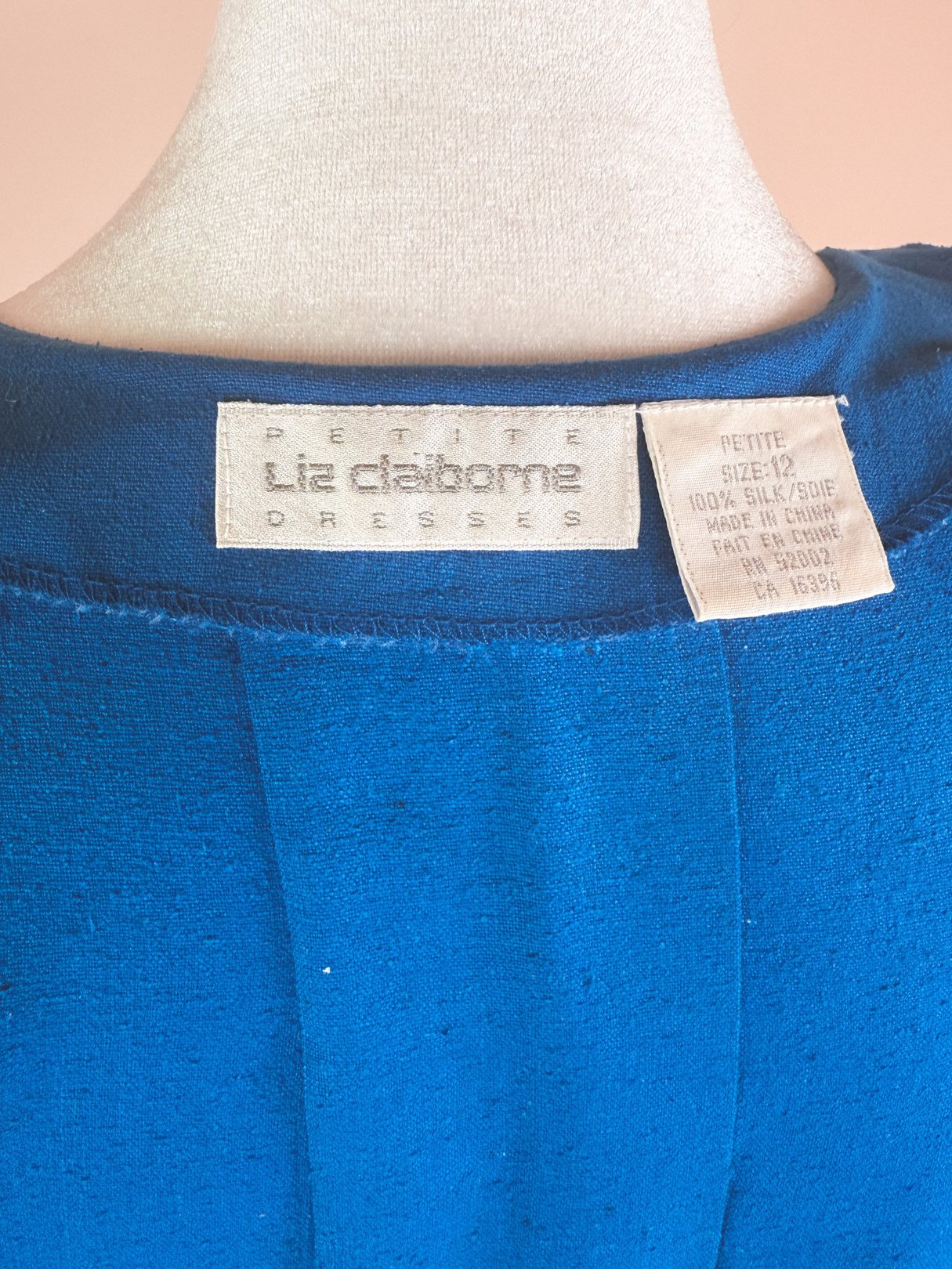 Cerulean blue 1980s dress labeled as "Petite Le daborne Dresses," made of 100% silk and size 12.