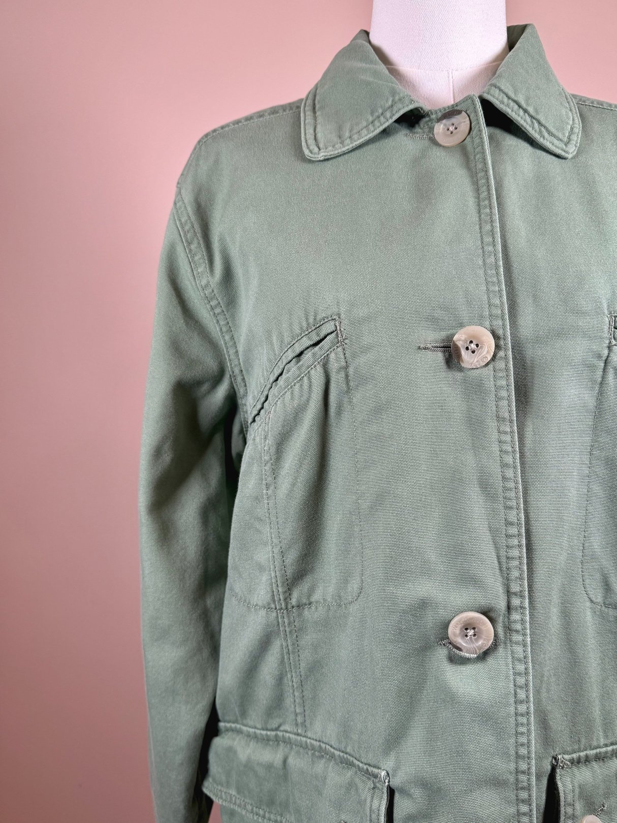 Sage quilted wool jacket for women from the 1970s featuring a collar and button front.
