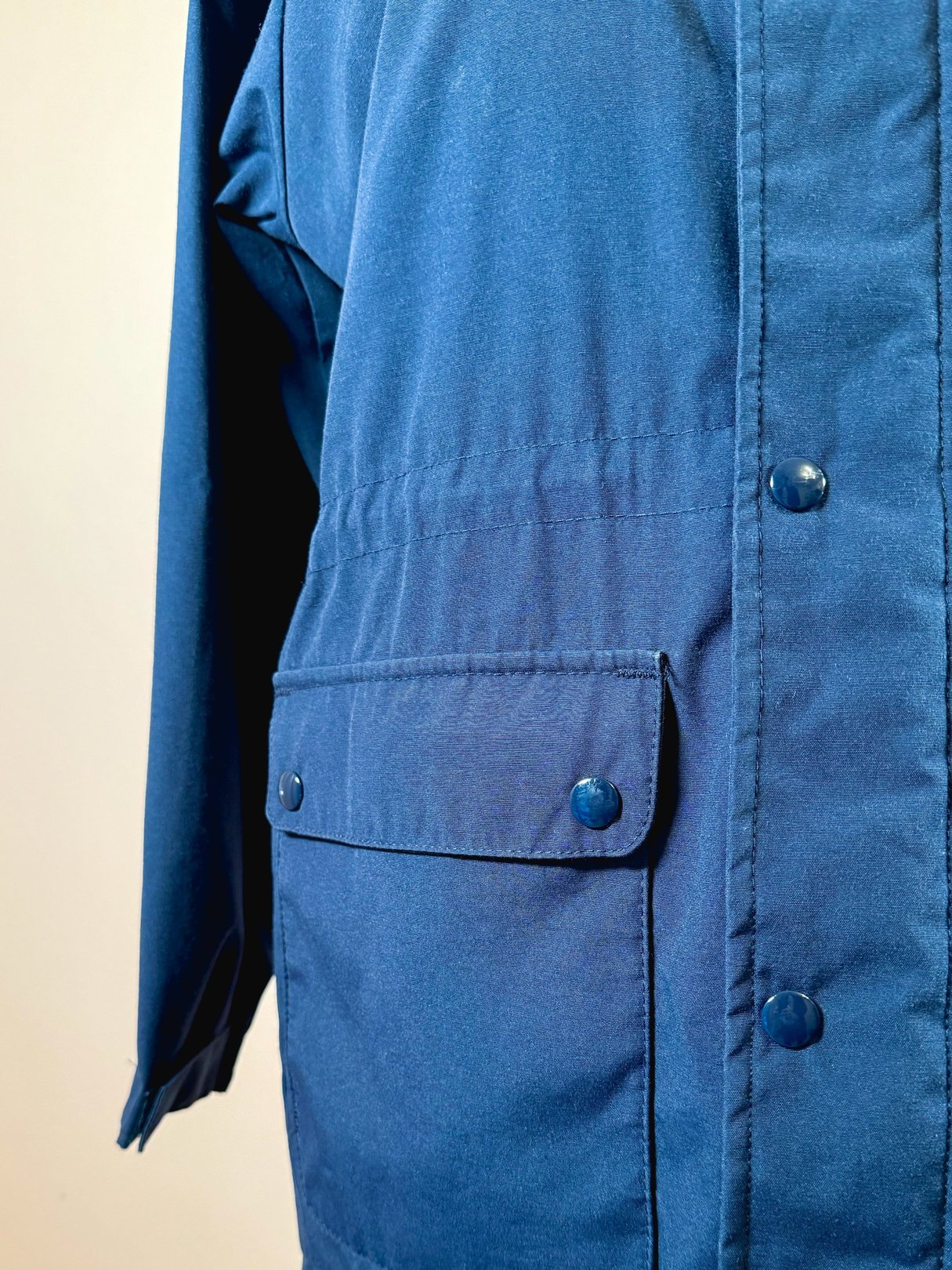 Navy blue utility field coat for women featuring a button closure and front pockets.