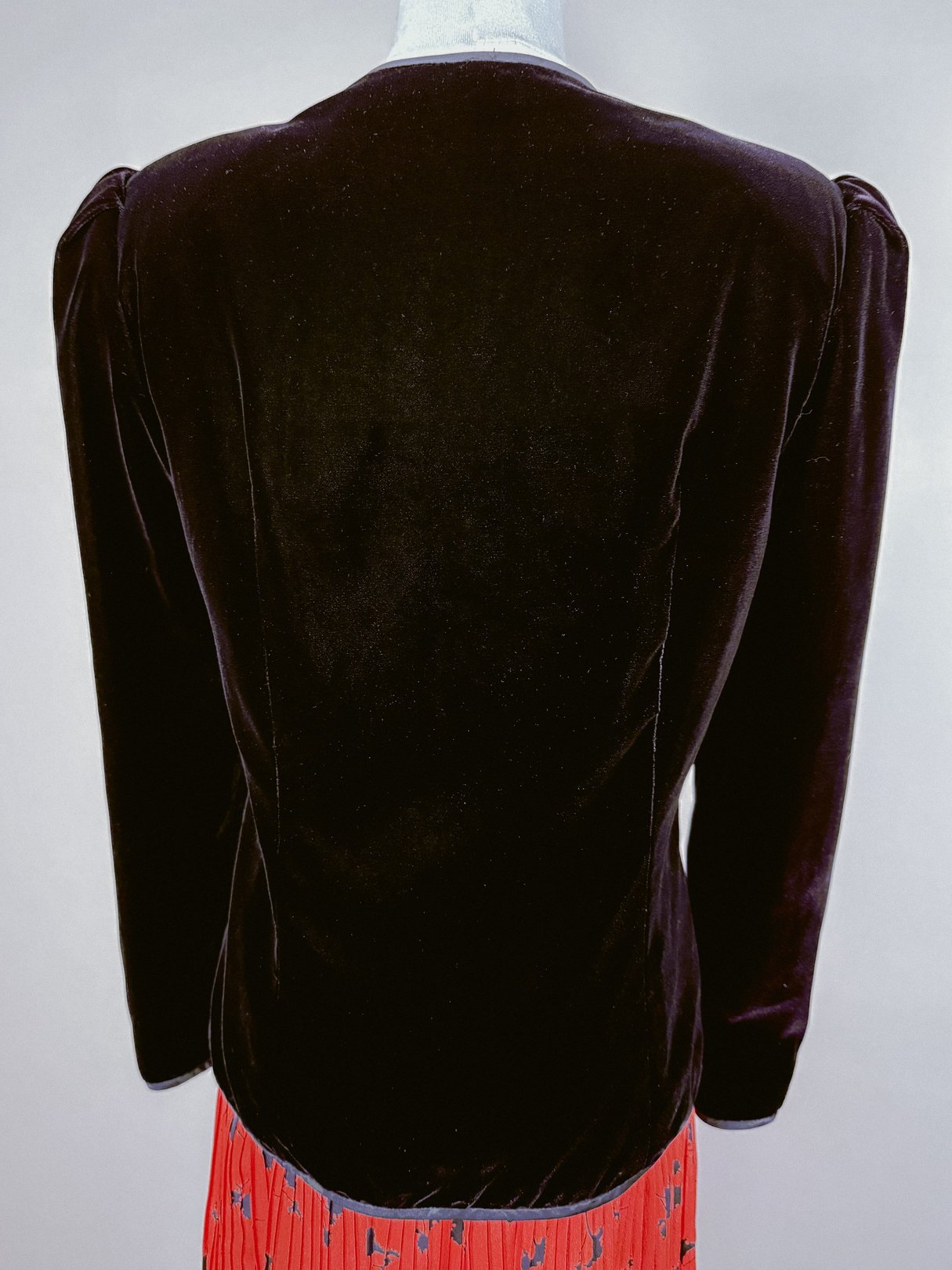 Black velvet jacket for women, 1980s style, showcasing a smooth back design.