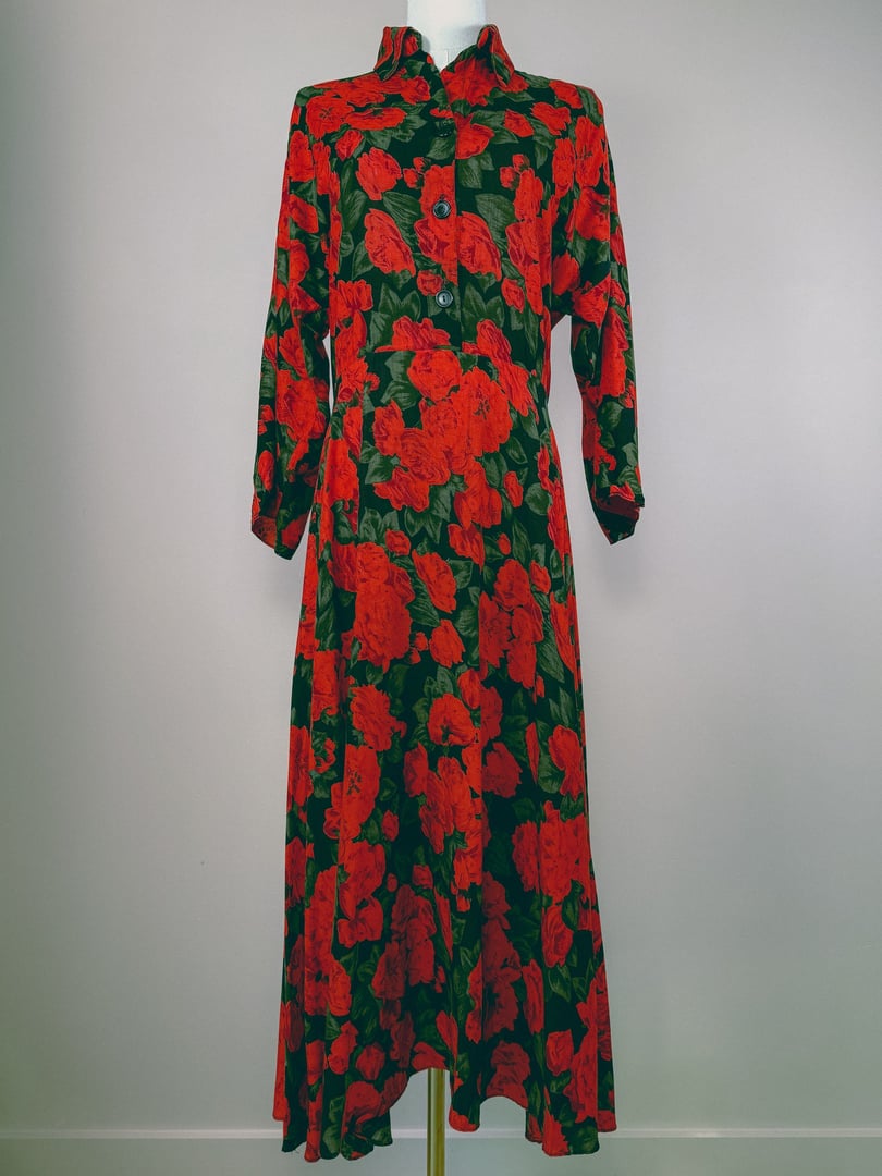 Red floral dress with a long, flowing silhouette and buttons, featuring a 1990s style.