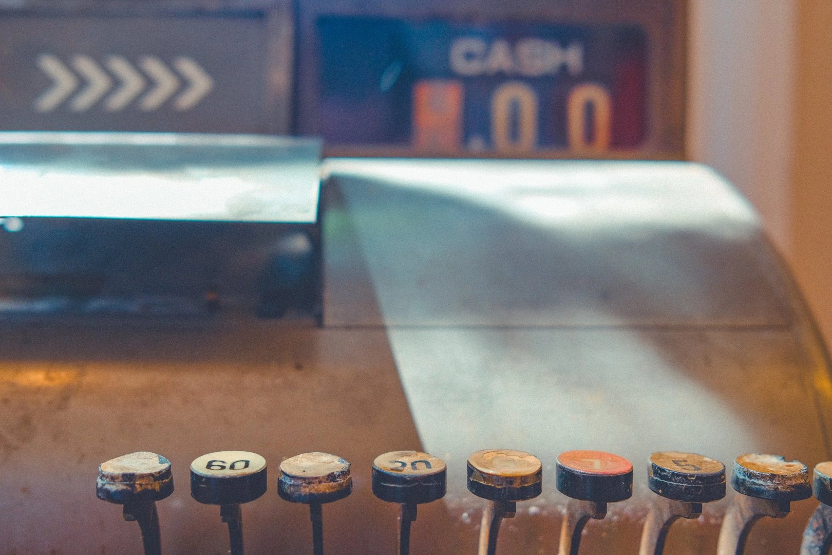 Close-up of vintage cash register buttons and display.