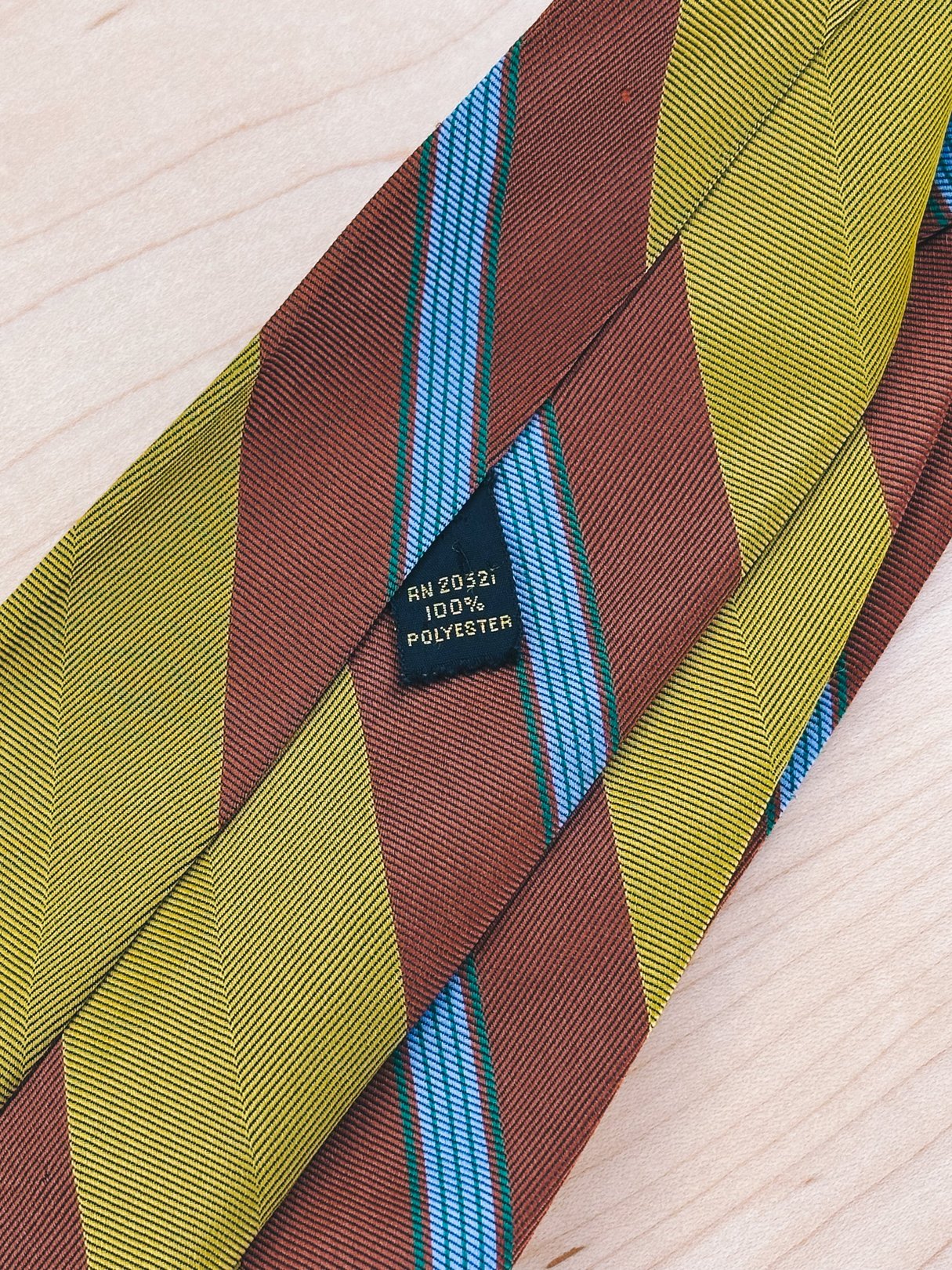 Chartreuse and brown striped tie from the 1970s, made of 100% polyester, designed for women.