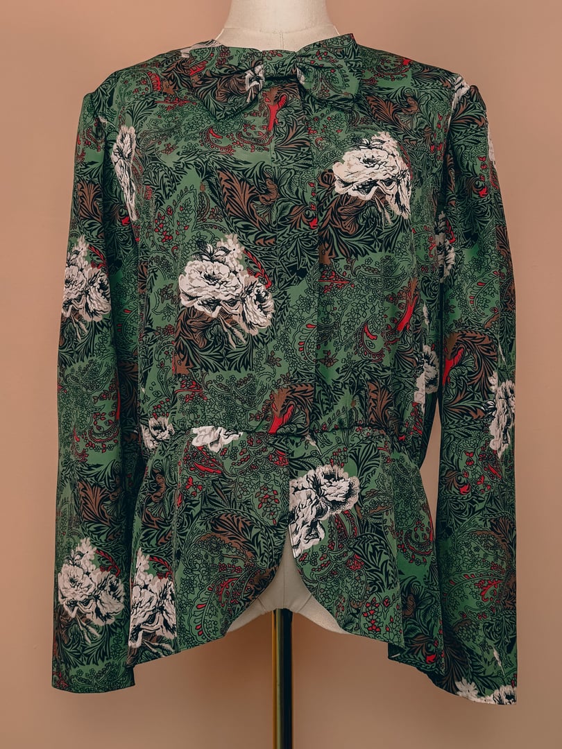 Vintage women's Evergreen Bow Top from the 1980s, featuring a floral green and red pattern with a bow detail at the neckline.