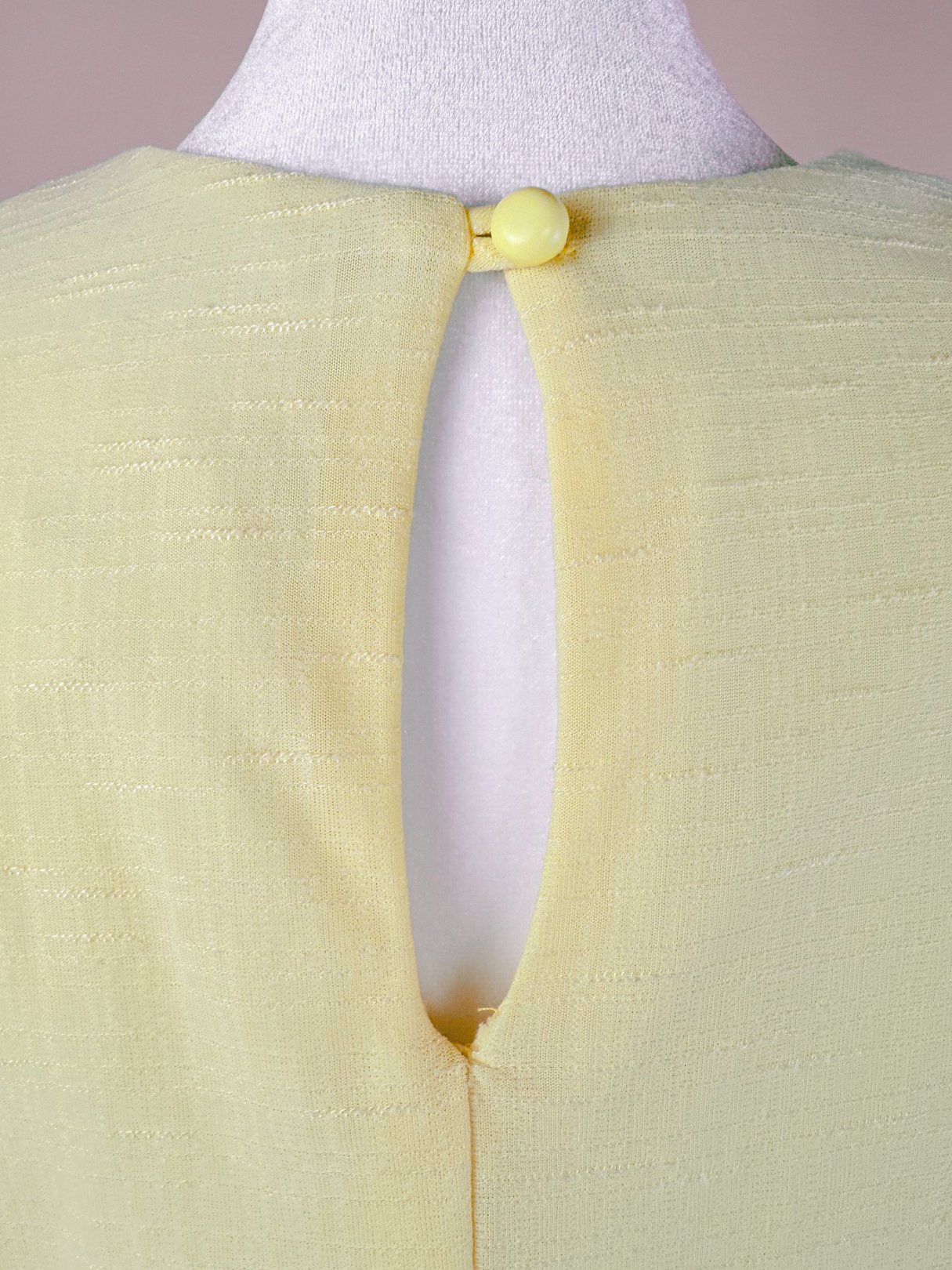 Yellow Lemon Chiffon Dress with a keyhole back and button closure, designed for women in the 1980s.
