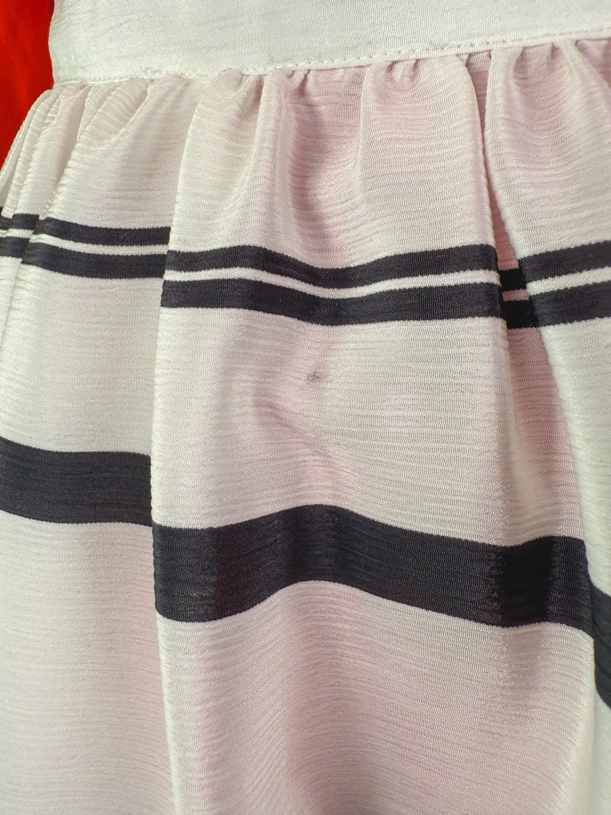 1970s women's Tide Line Skirt in white with black stripes and gathered texture.