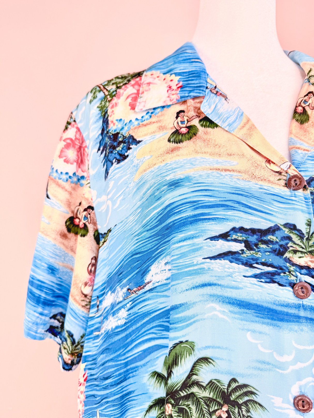 1960s blue Aloha Darling Top for women featuring a tropical print with beach and floral designs.