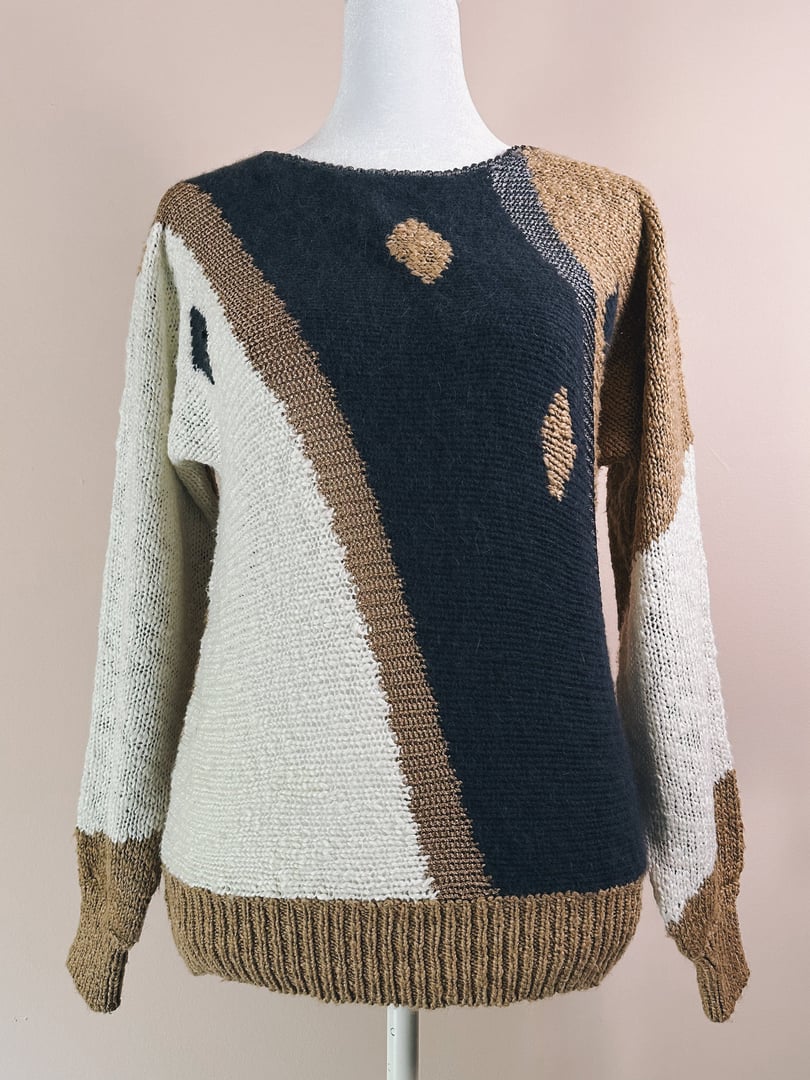 Blue and beige abstract patterned sweater for women from the 1980s, featuring a relaxed fit and textured knit.