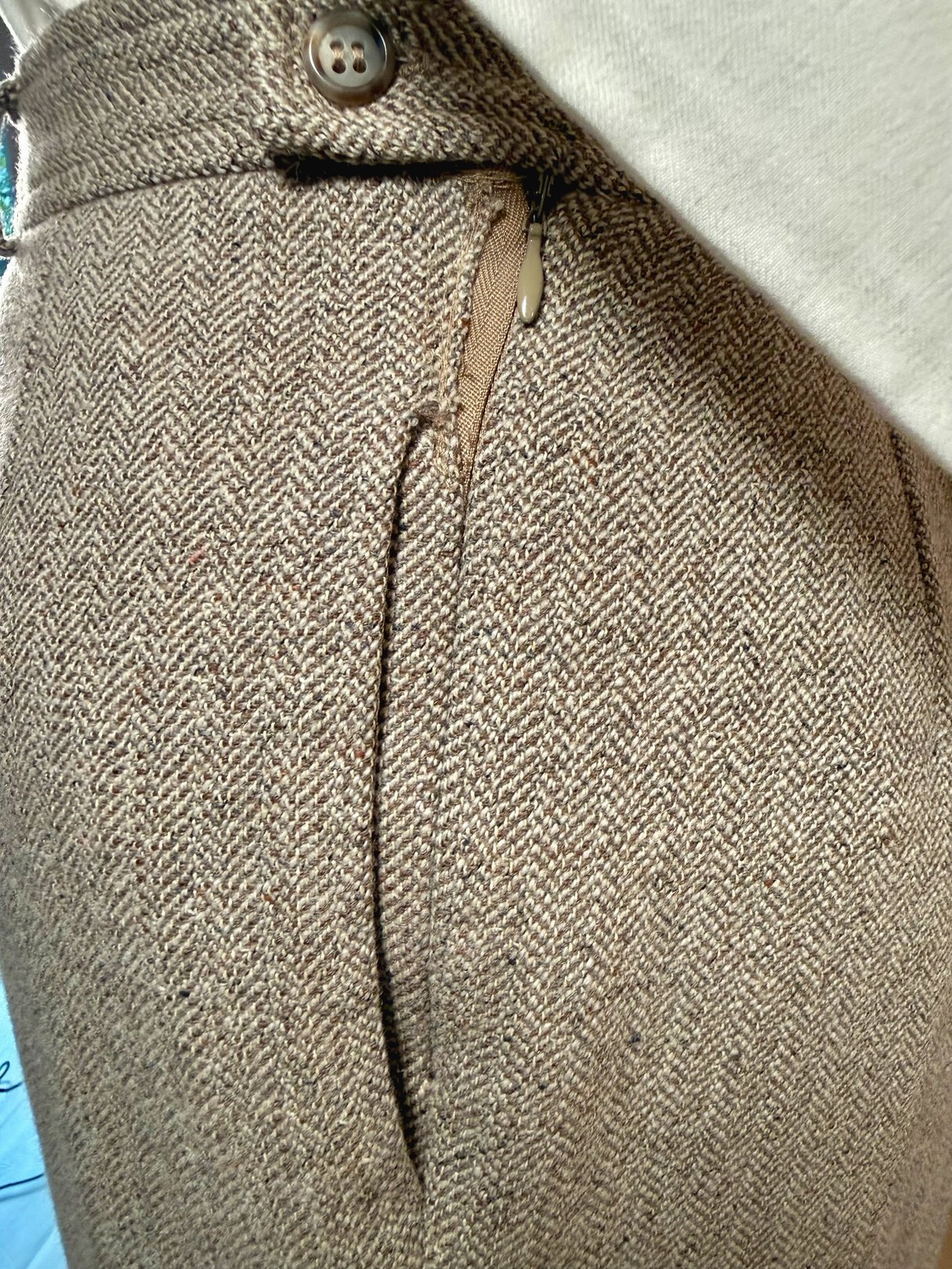 Tan birch tweed pants for women from the 1990s, featuring a herringbone pattern and side pockets.