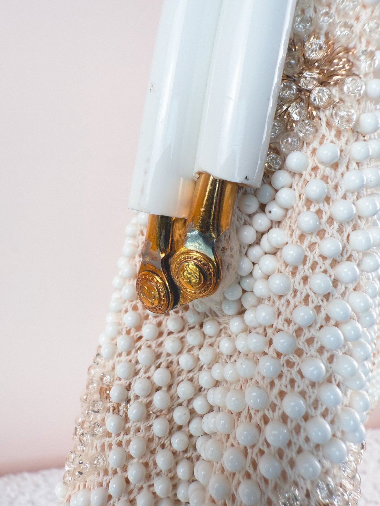 Cream white 1950s Golden Wish handbag adorned with sparkling beads and gold-tone hardware.
