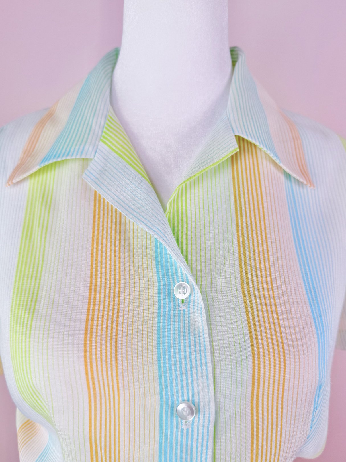 1950s women's Citrus Dress featuring colorful vertical stripes in orange, green, and blue with a collared neckline.