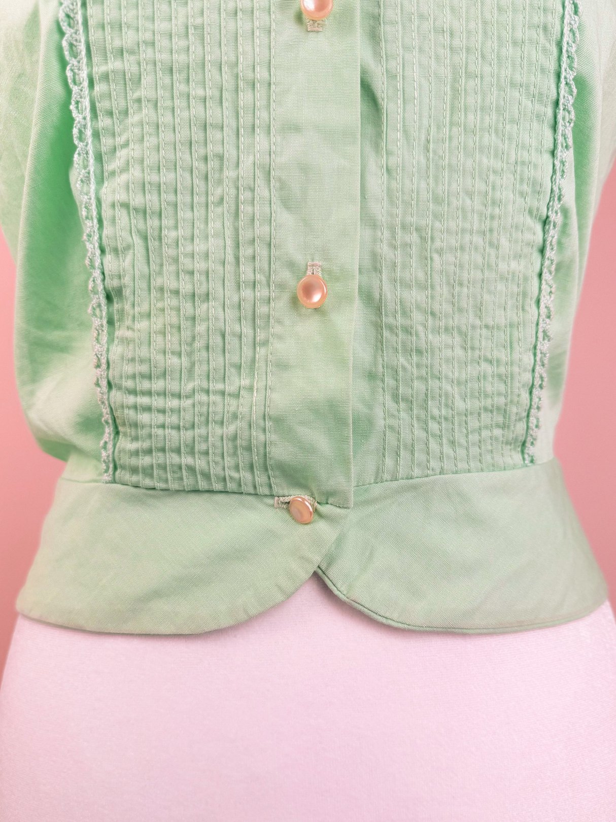 Mint Chip Ice Cream Top in mint green with a button-down front and textured fabric, designed for women in the 1950s.