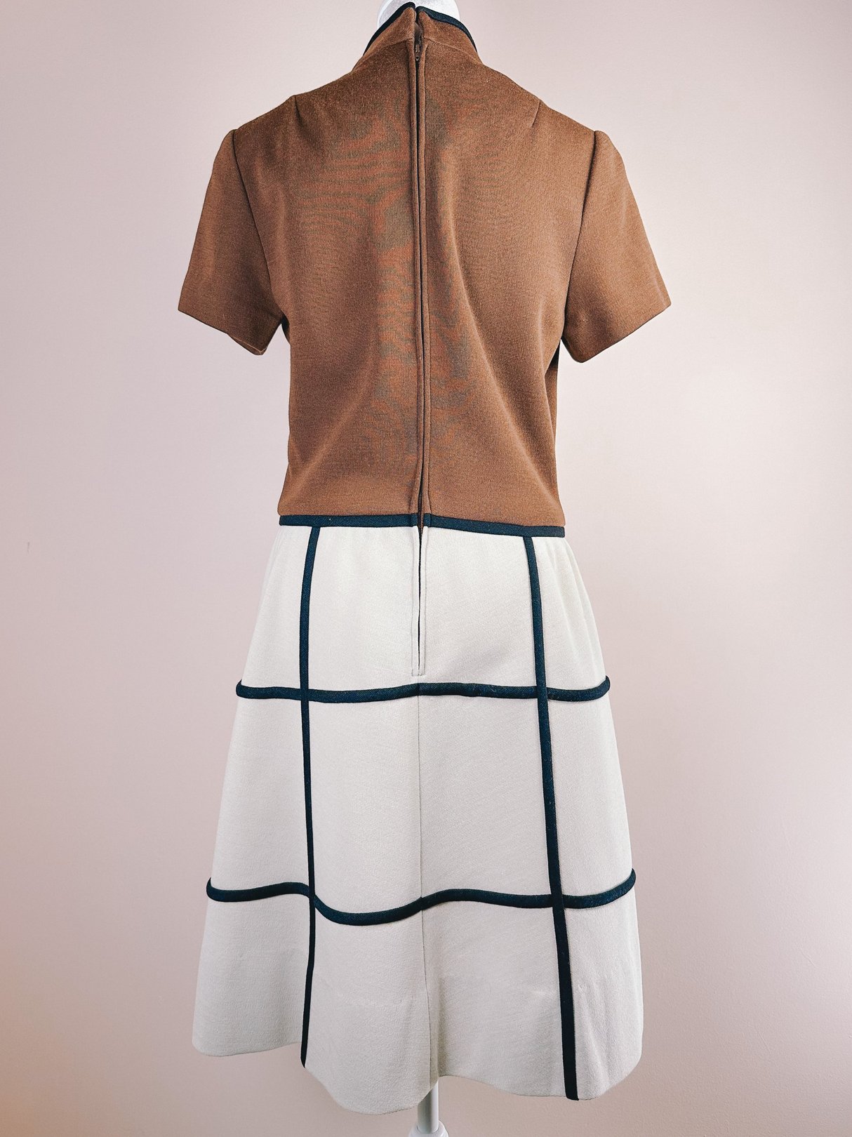 Brown 1960s British Mod Squared Dress featuring a fitted top and a flared skirt with a grid pattern.