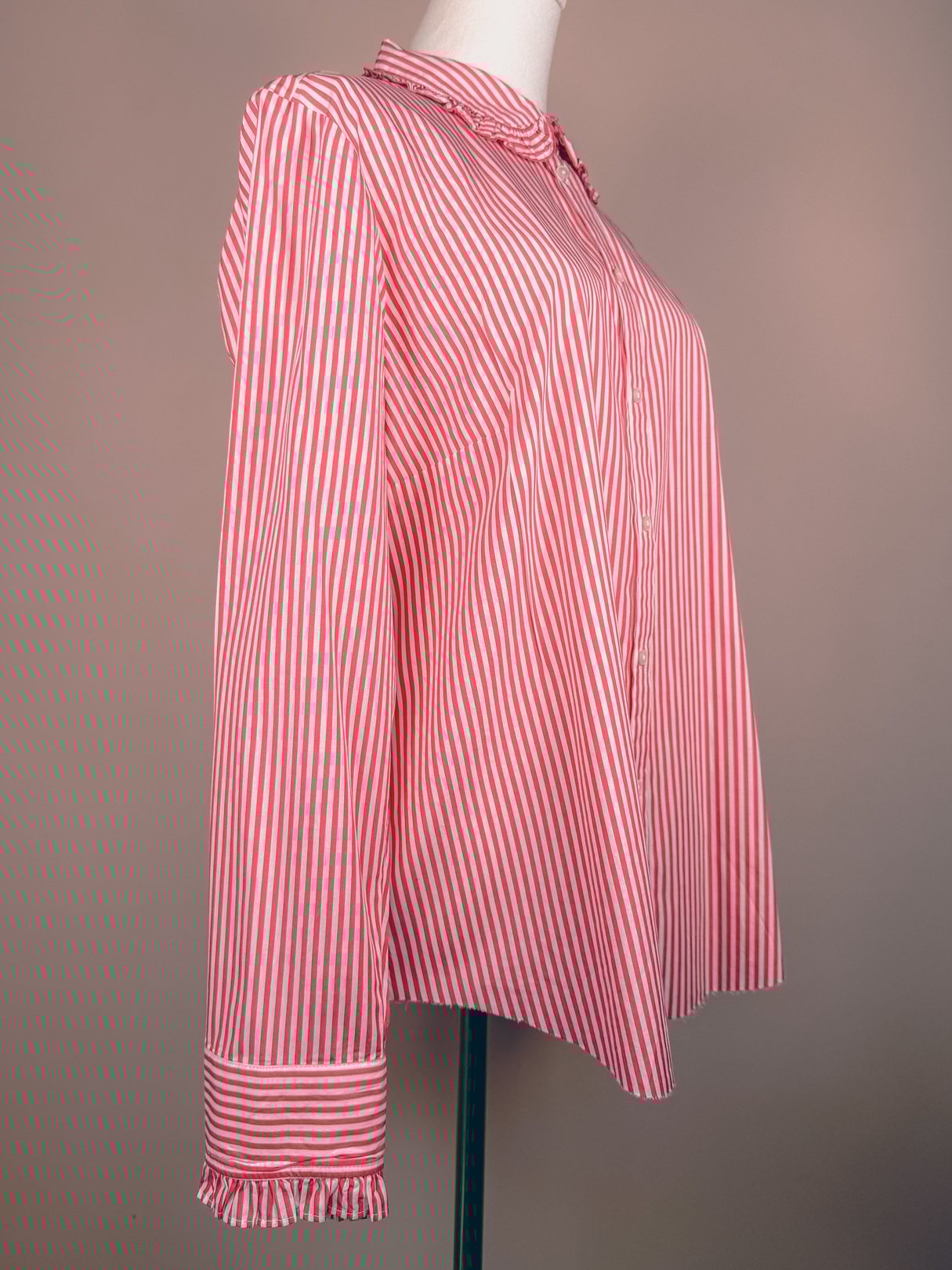 Red and white striped button-down top for women with long sleeves and a ruffled cuff, featuring a 1970s design.