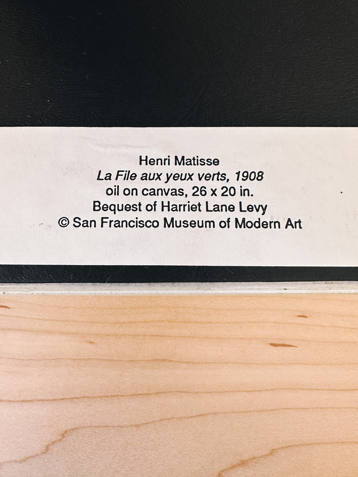 Ceramic portrait inspired by Matisse's "La fille aux yeux verts," featuring a yellow color palette, from the 1970s, suitable for home decor.