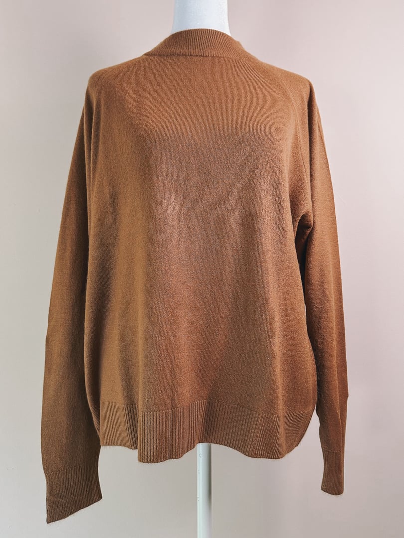 Caramel brown women's mock neck sweater from the 1960s featuring a relaxed fit and long sleeves.