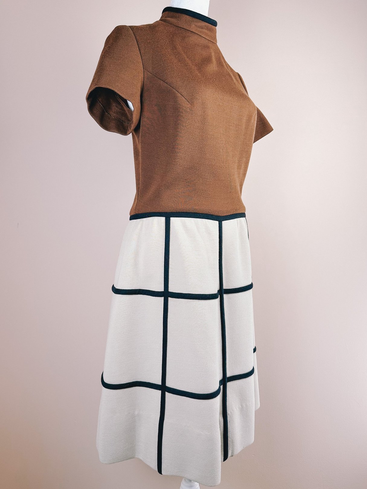 Brown 1960s British Mod Squared Dress featuring short sleeves and a grid pattern on the skirt.