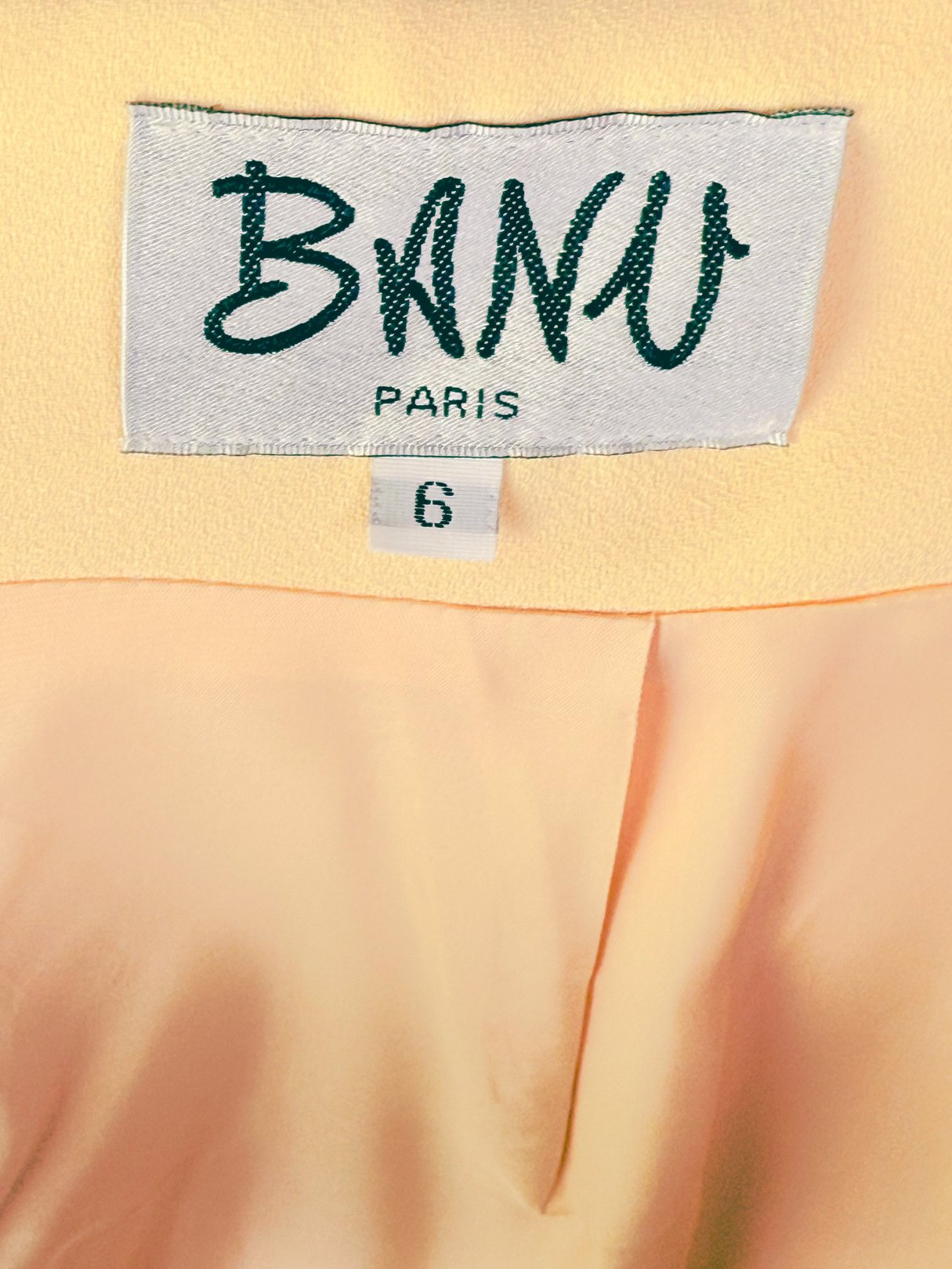 Buttery yellow skirt labeled "Banu Paris" size 6, indicative of 1990s women's fashion.