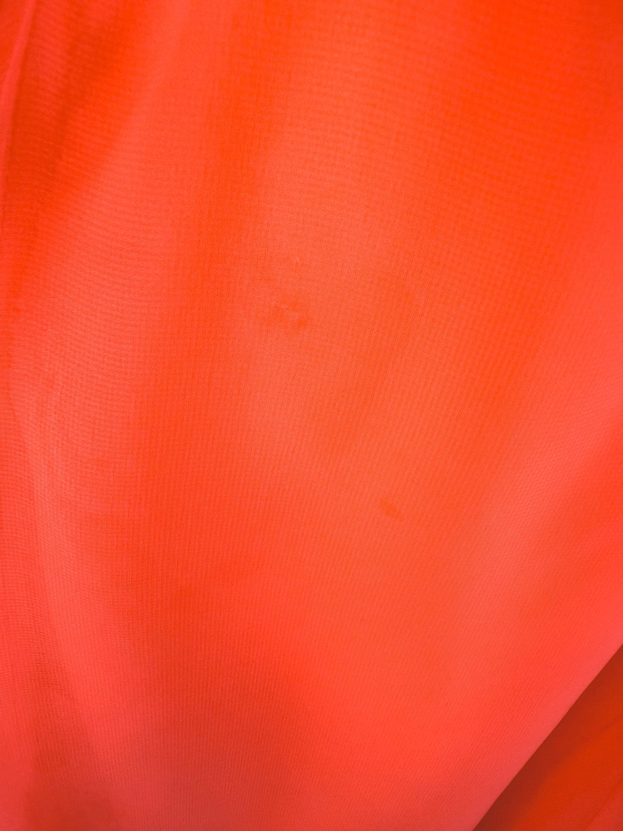 Coral Soirée Dress in a vibrant coral hue featuring a smooth fabric texture from the 1960s era.