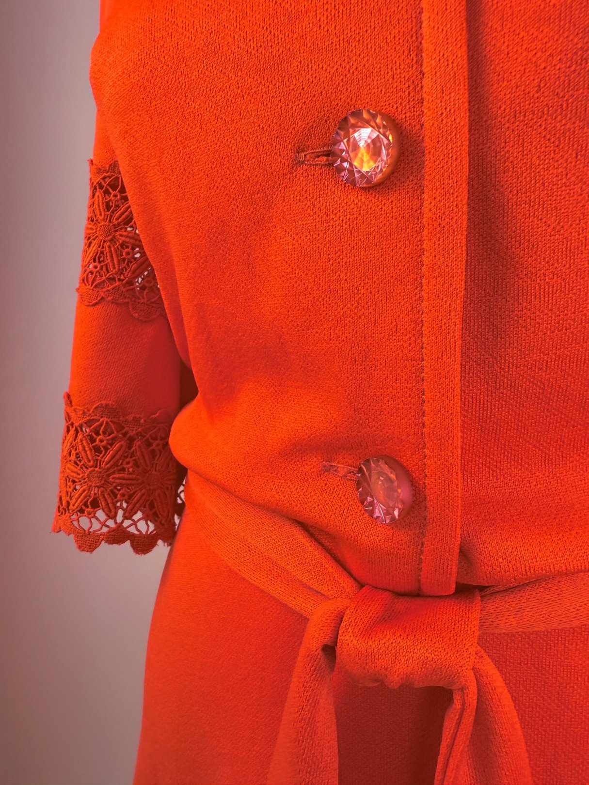 Red 1970s women's Cherry Lace Bell Dress featuring lace detailing on the sleeves and decorative buttons.