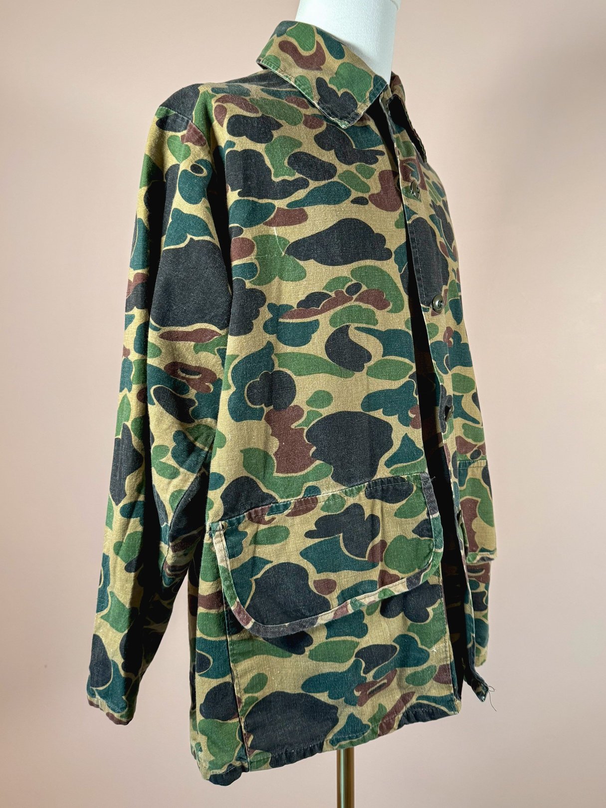 Men's Jim "Catfish" Hunter camo jacket in 1970s style featuring a camouflage green pattern.