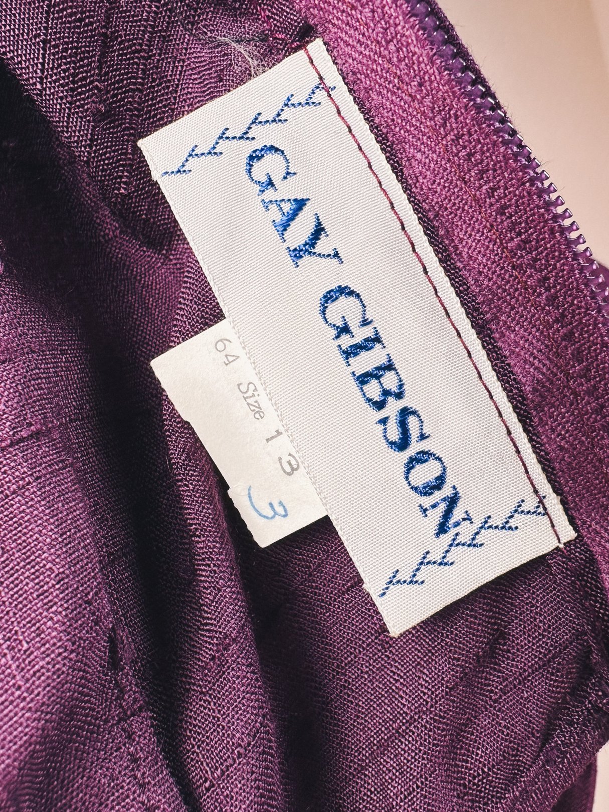 Purple Royalty Bow Dress by Gay Gibson, women's 1960s dress in purple with a size tag of 6A.