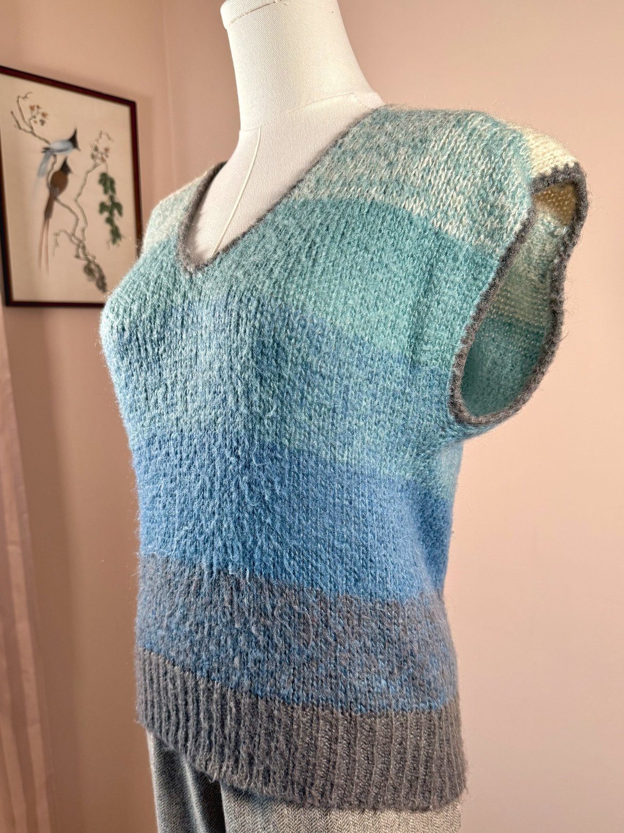 1970s women's blue mohair sweater vest featuring a v-neck and sleeveless design with varying shades of blue and gray.
