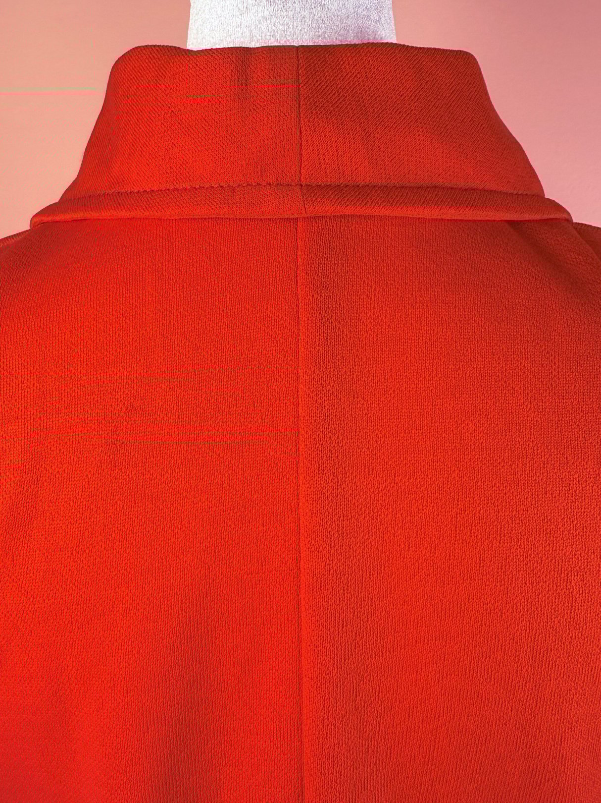 The back view of a red 1970s Cherry Lace Bell Dress featuring a high collar design.