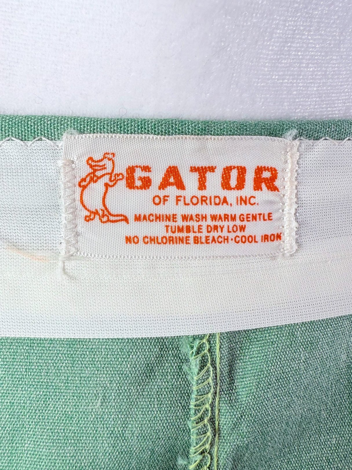 Green 1970s women's skort featuring a Gator brand label.