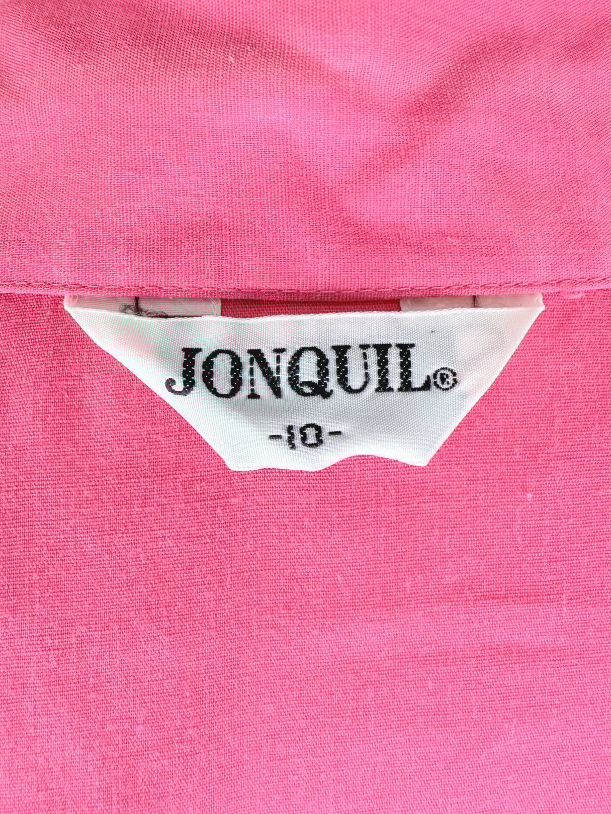 A pink top with a tag reading "JONQUIL," designed for women, from the 1980s.