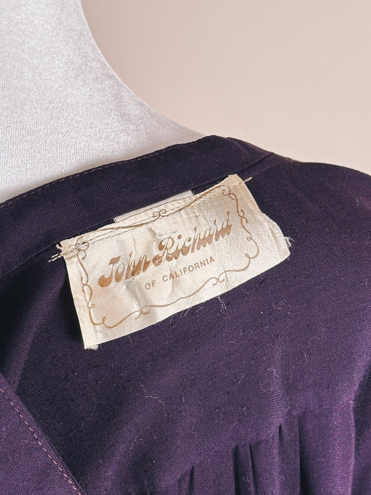Purple 1970s women's dress labeled "John Richards of California.