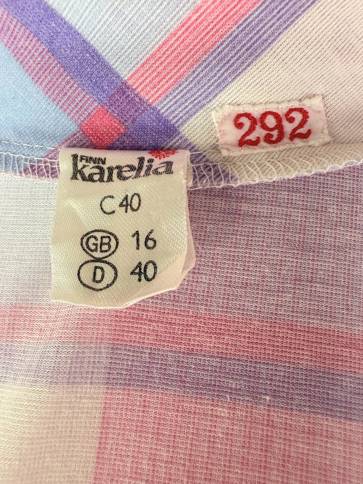 Label inside a purple plaid dress showing sizes C40, GB 16, and D 40.
