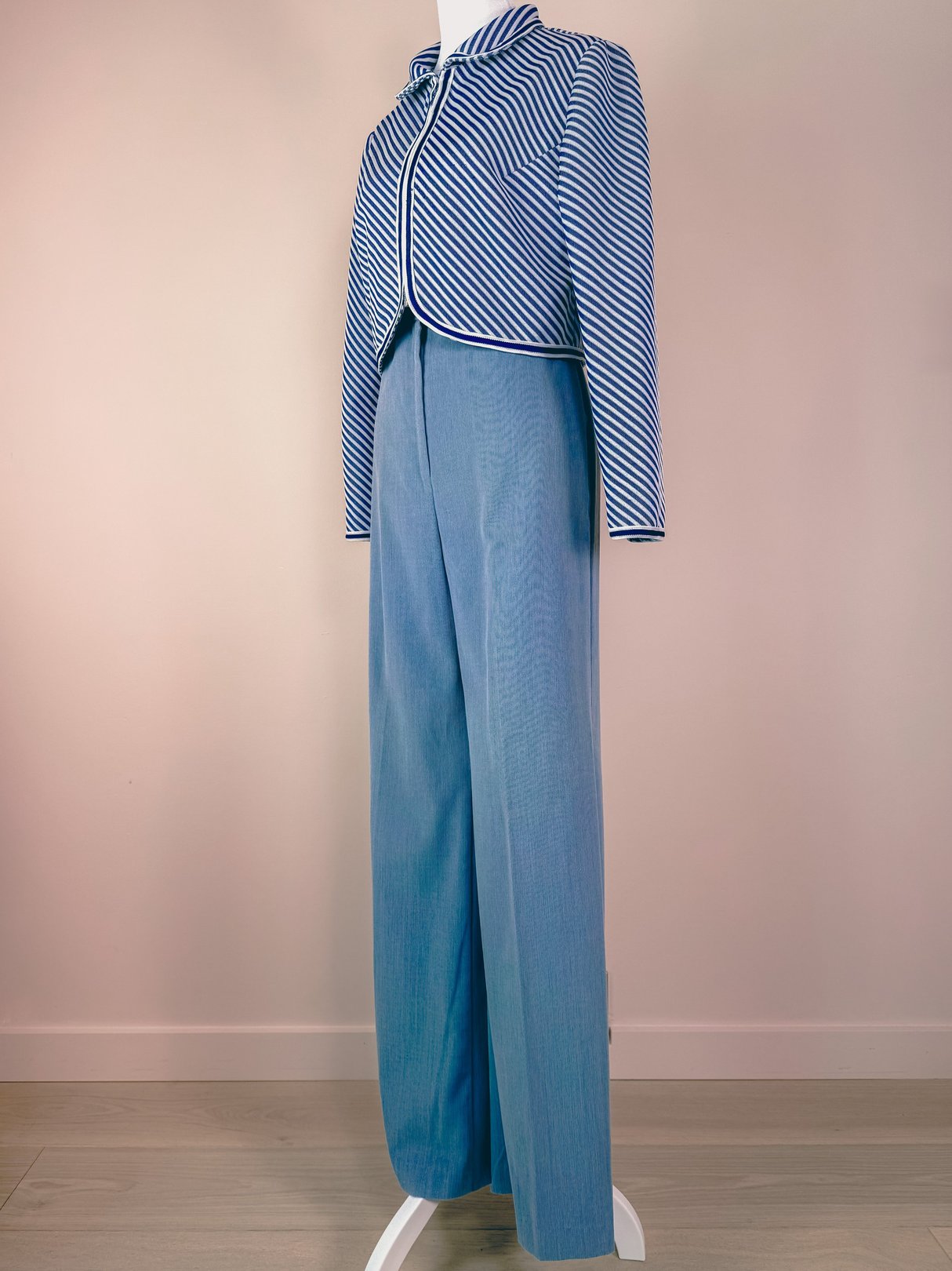 Navy blue 1960s women's Rue de Swing jacket with striped detailing and a cropped design, displayed on a mannequin.