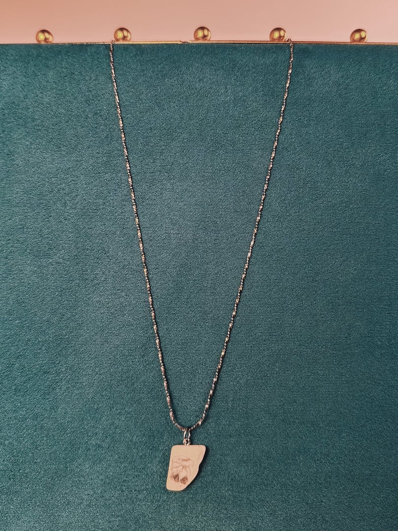 Sterling silver necklace featuring a coastal eagle pendant on a chain, showcasing a white finish.