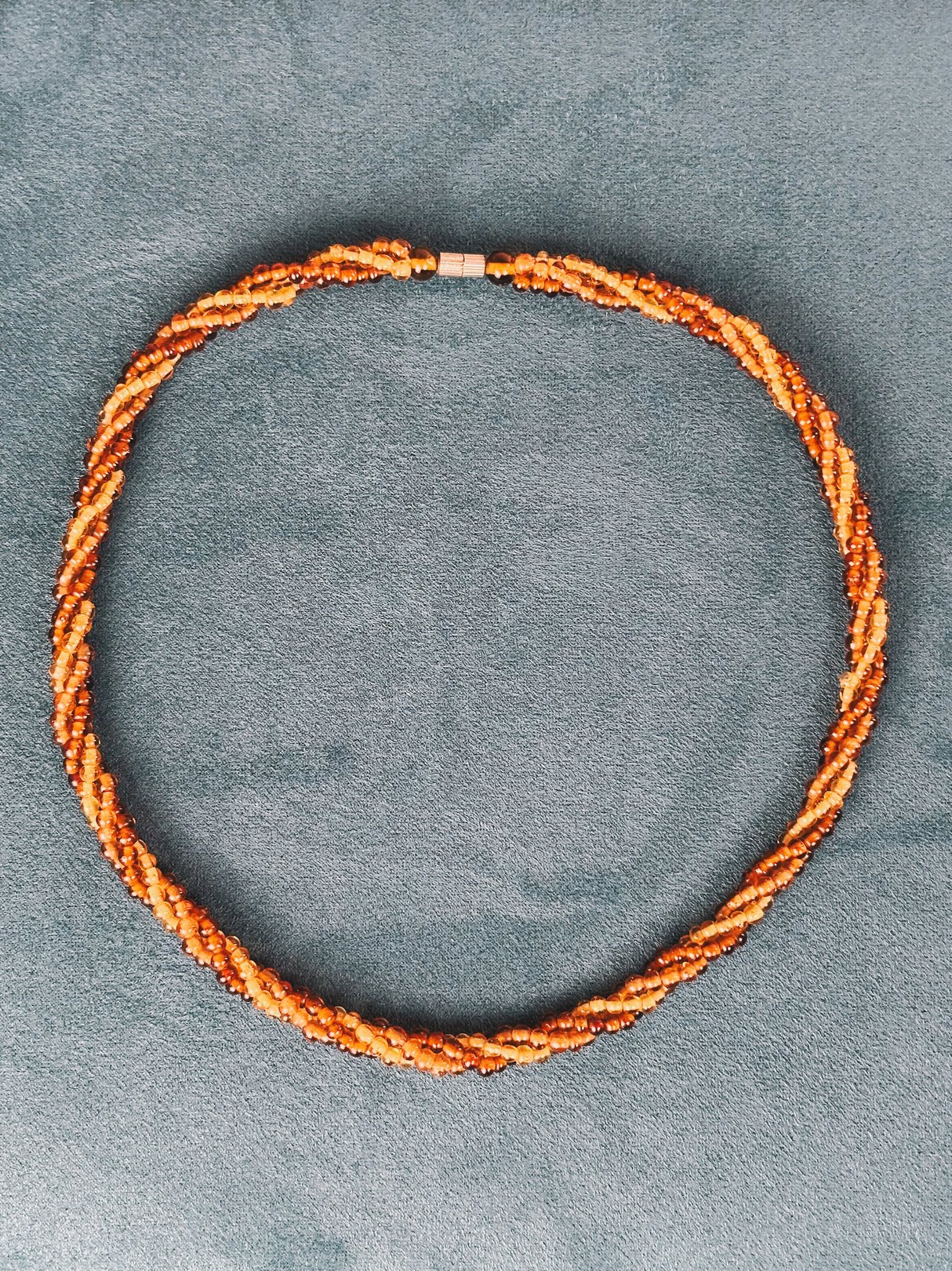 Amber Harvest Beaded Necklace featuring twisted strands of amber-colored beads.