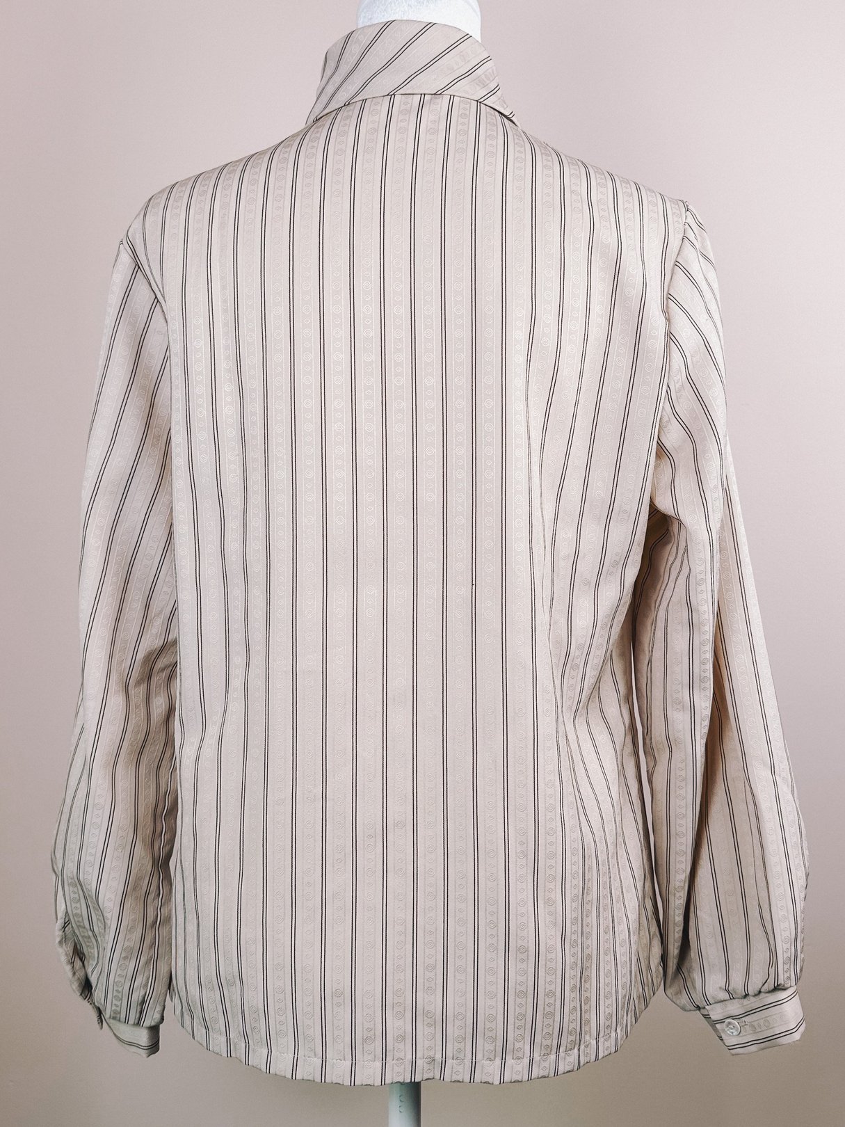 Maroon striped blouse with a tan background, featuring a back view and long sleeves, from the 1980s.