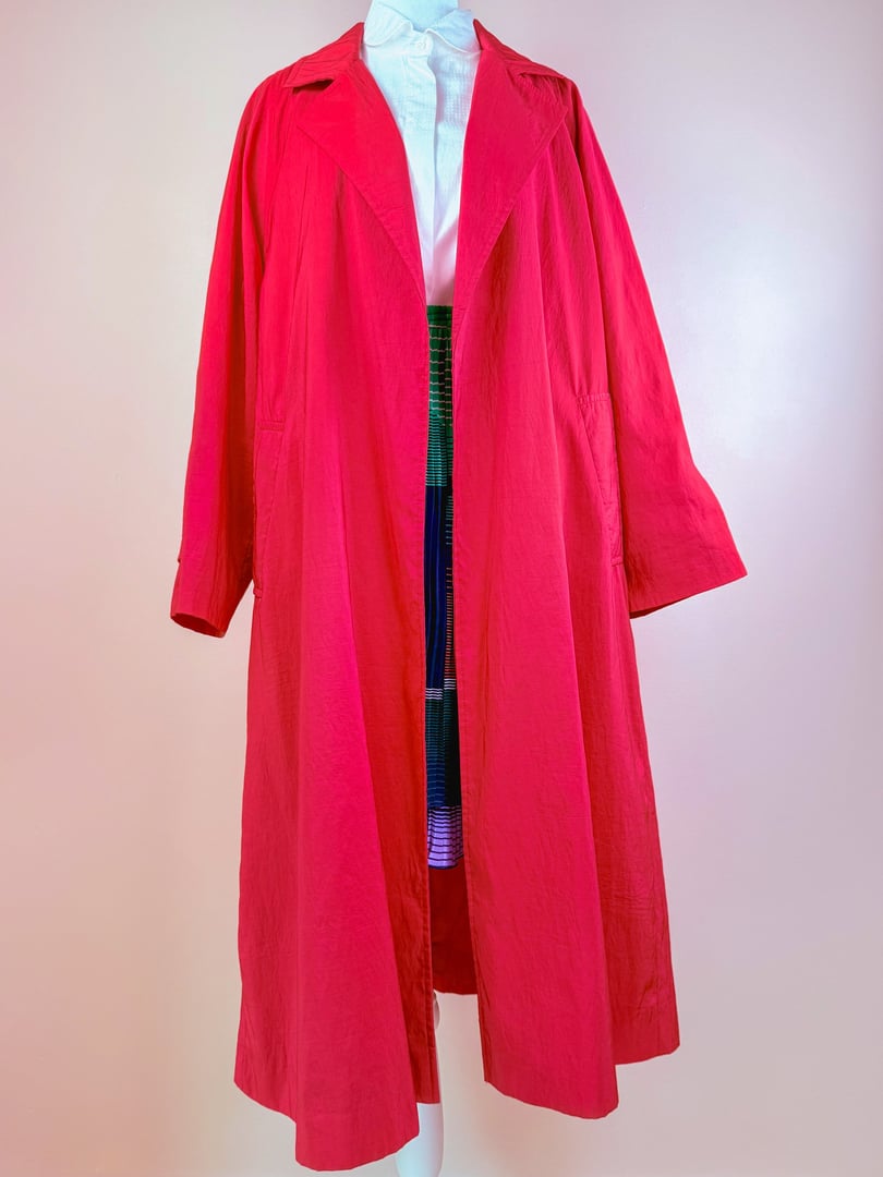 1980s women's red Poppy Forecast rain jacket featuring a long, loose fit and wide lapels.