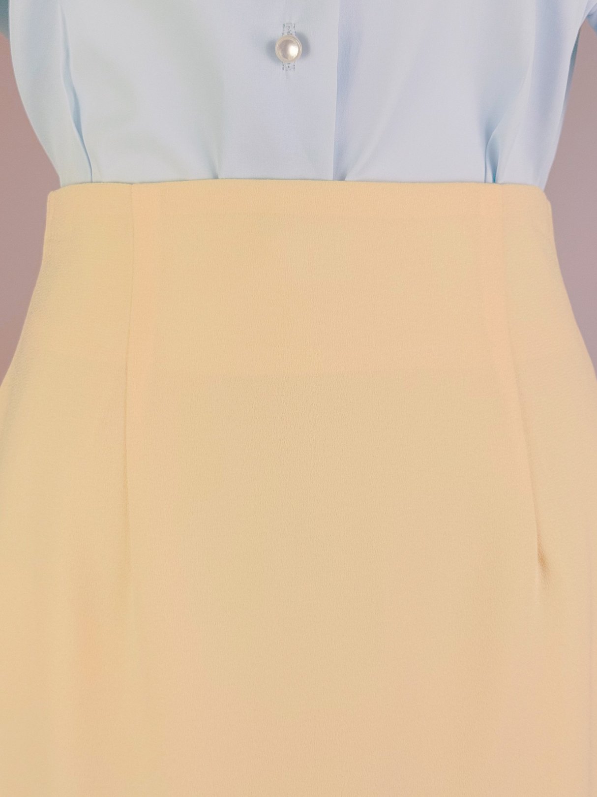Buttery yellow 1990s women's skirt with a classic high waist design.