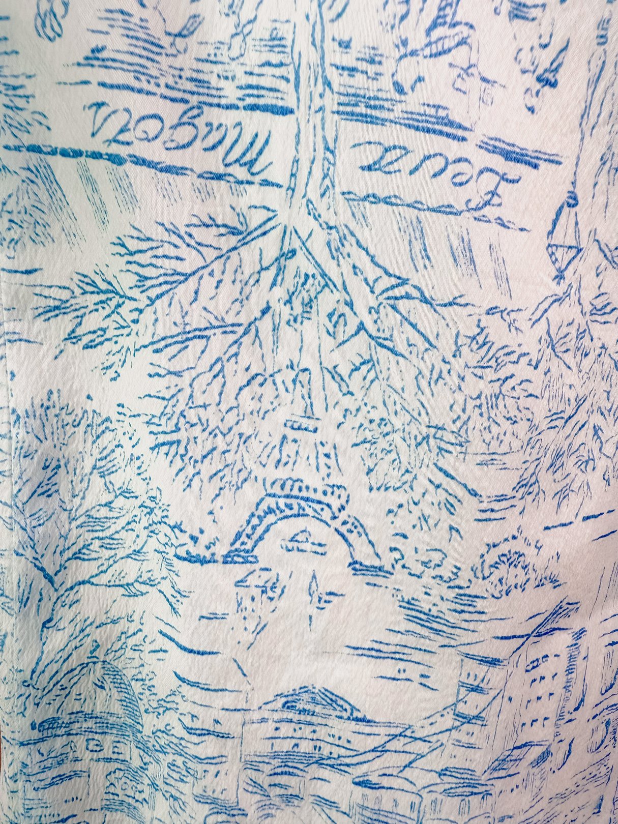 Blue 1960s Paris Montage Dress featuring a printed design with iconic Paris landmarks.