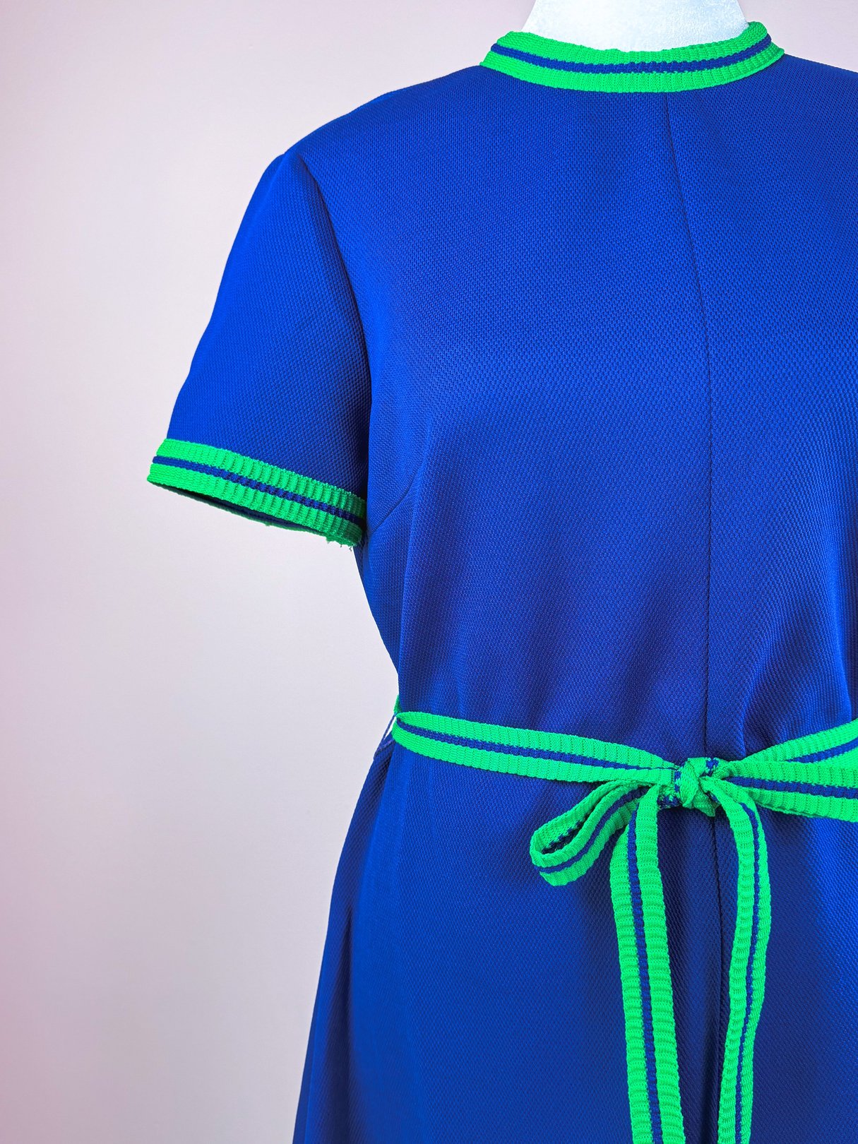 1970s women’s Pacific Lines Dress in blue with green trim and a matching belt.