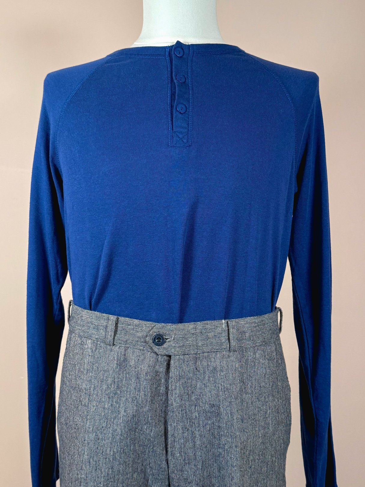 Nino Cerruti trousers for men from the 1980s in a blue and gray color combination, displayed on a mannequin.