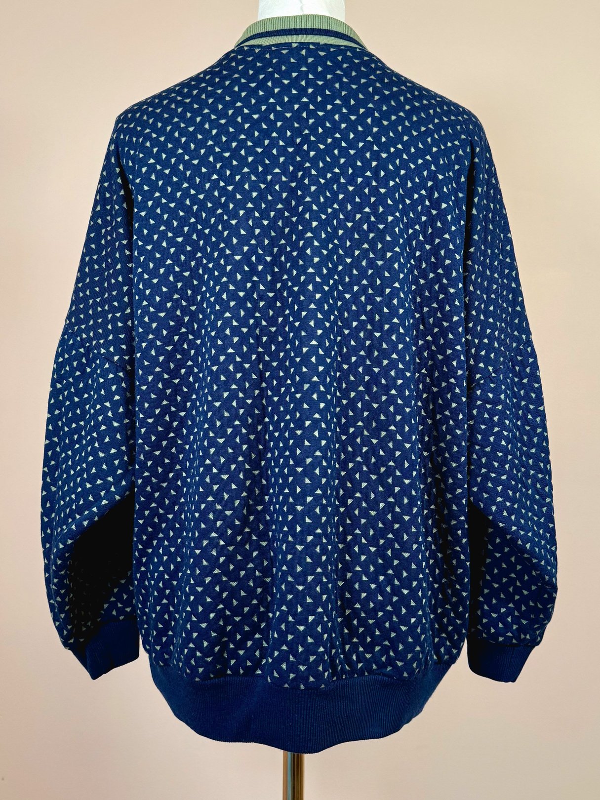Navy blue women's triangle top from the 1980s featuring a geometric pattern and long sleeves.