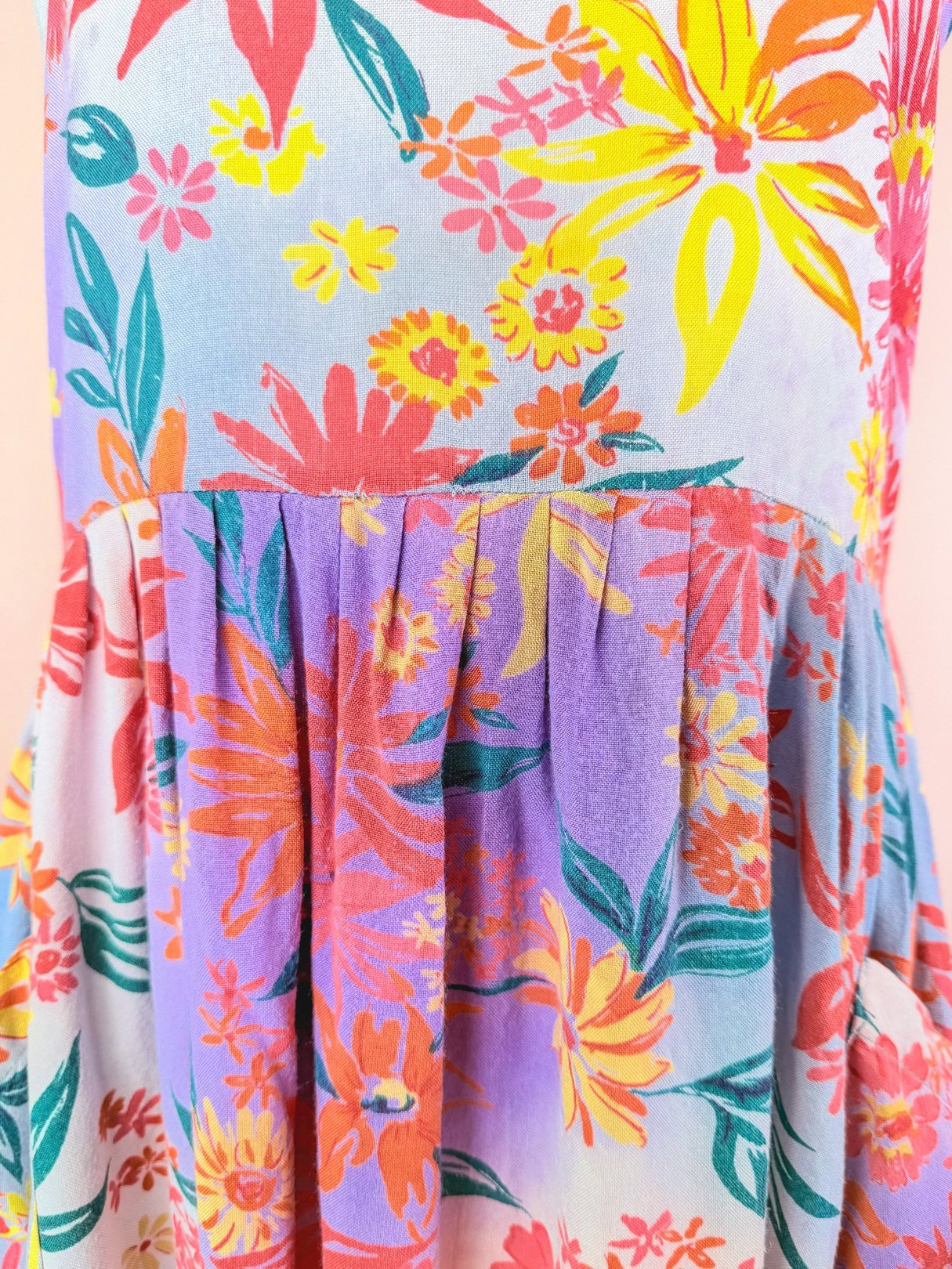 1990s women's Summer Bouquet Dress in pink with a vibrant floral print featuring orange, yellow, and purple hues.