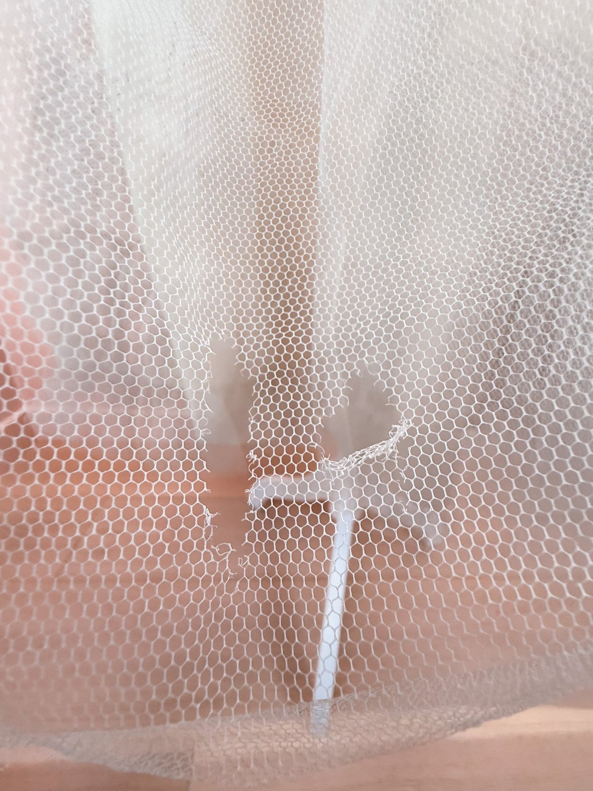 The Twilight Waltz Dress features a silver fabric with a hexagonal mesh design, showcasing a vintage 1950s style.