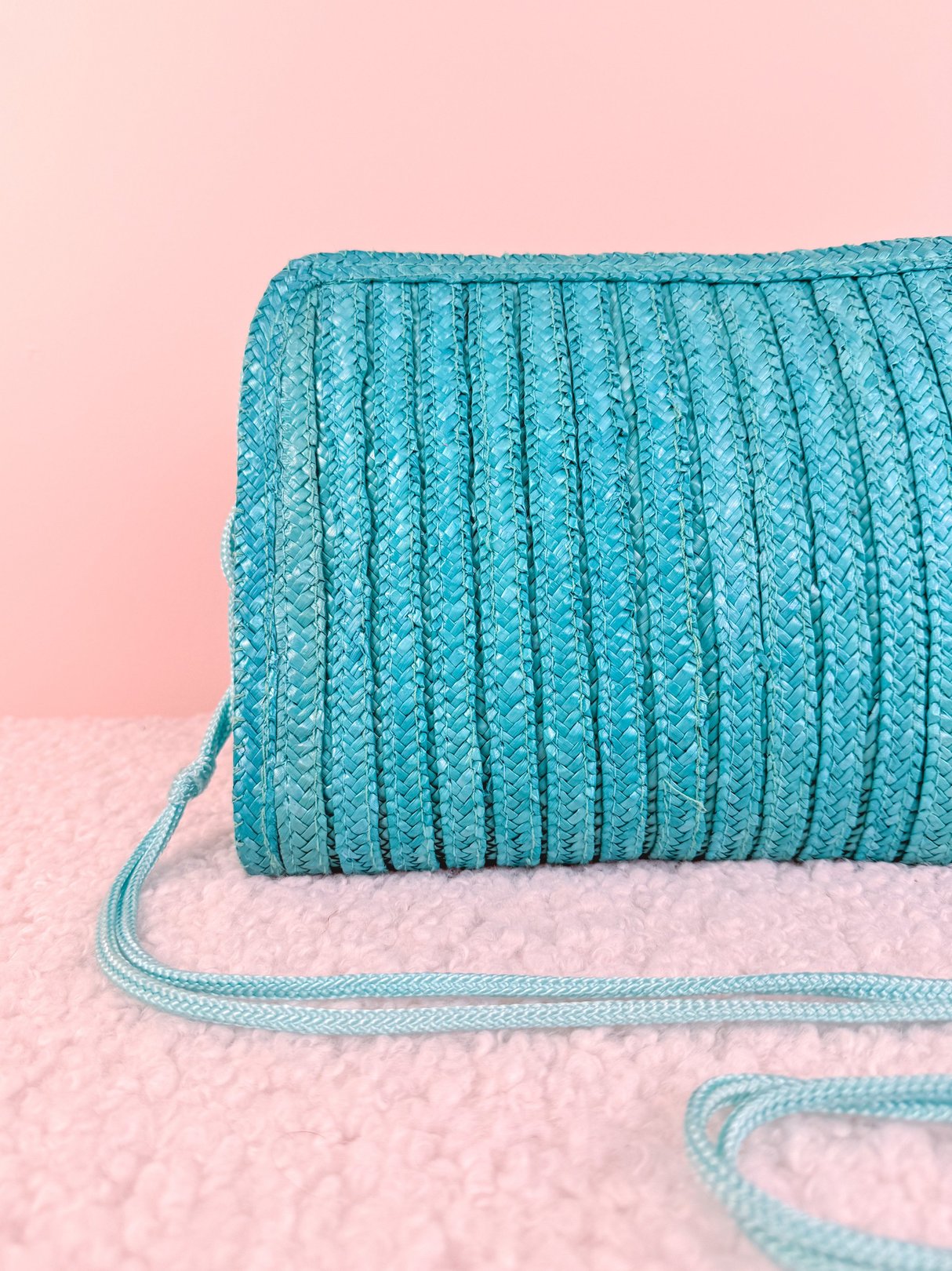 Teal blue braided shoulder bag for women from the 1970s.